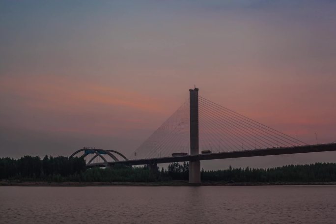 山东济南建邦黄河大桥日出朝霞夜转日延时