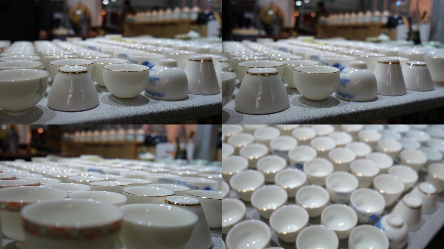 整齐排列的白瓷镶金边茶碗