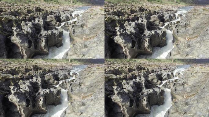 4K奇怪的石头岩石瀑布水流水花