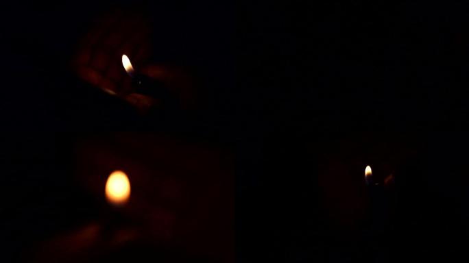 黑暗中点燃各种打火机烛光实拍慢镜头