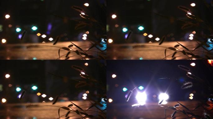 深夜城市晚上街道马路车辆驶过车灯