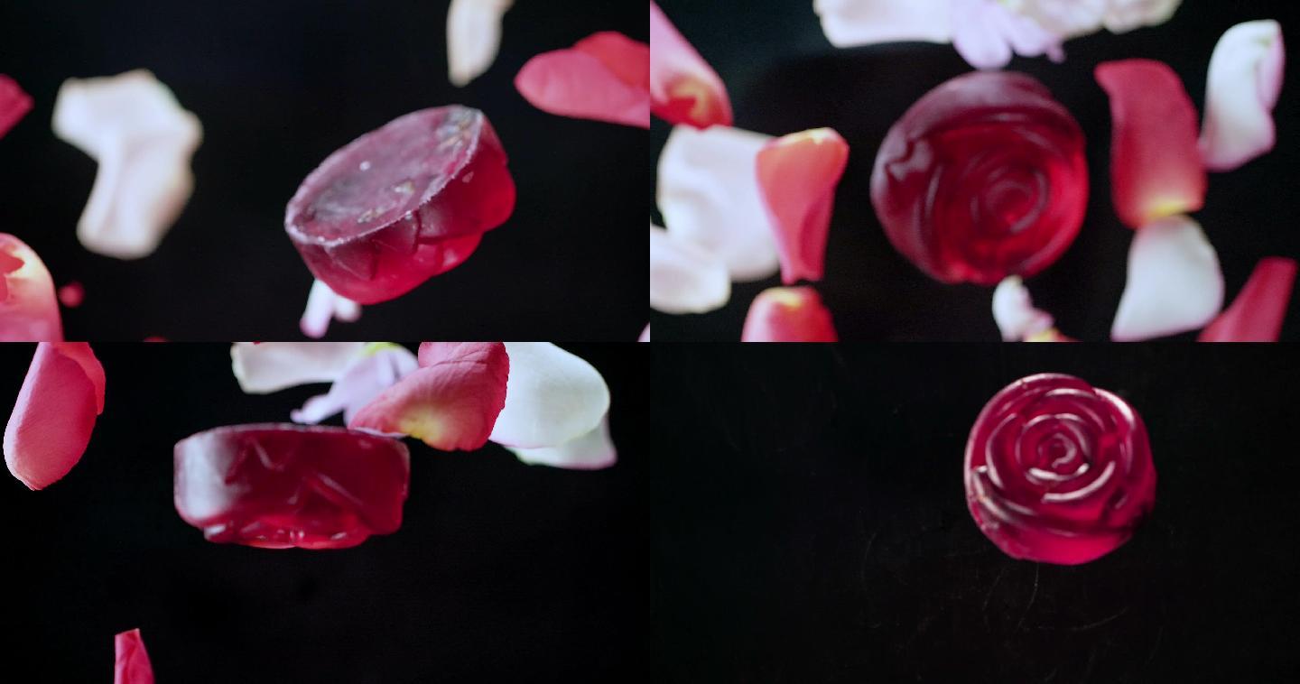 慢镜头视频，飞落的玫瑰花瓣和透明的红玫瑰