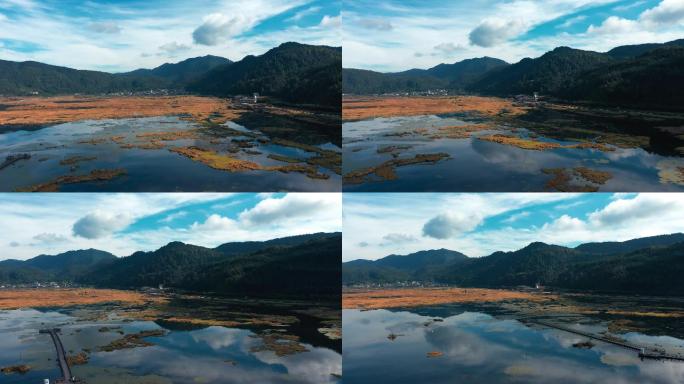 4k航拍，秋季蓝天白云下的湿地和倒影和景