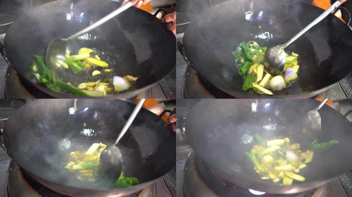 葱姜蒜在油锅中煸炒厨师厨艺大火烹饪