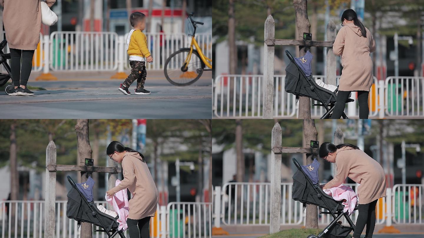 深圳市街头走路的小孩和推婴儿车的父母-
