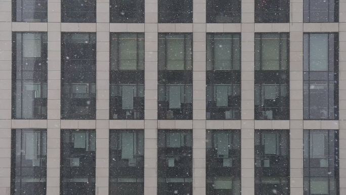 高楼大厦格子间雪景冬天大雪办公楼雪景