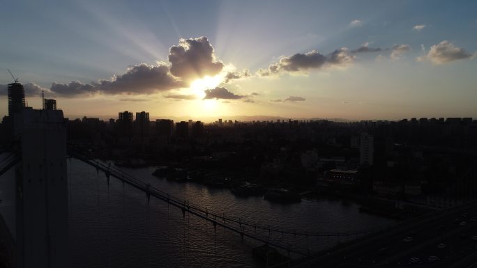 航拍夕阳下江边城市