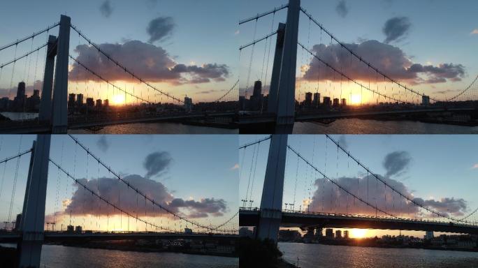 航拍夕阳下城市大桥