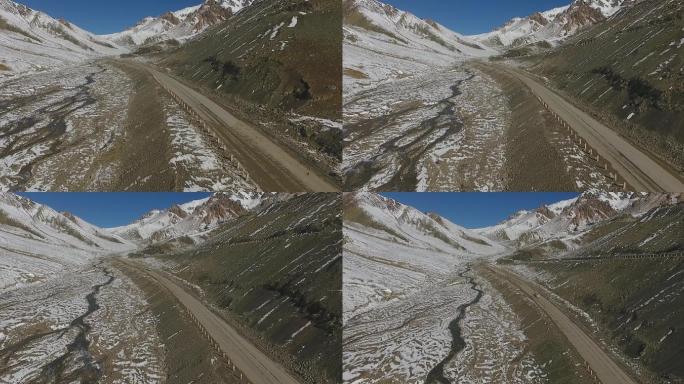 航拍雪山马路