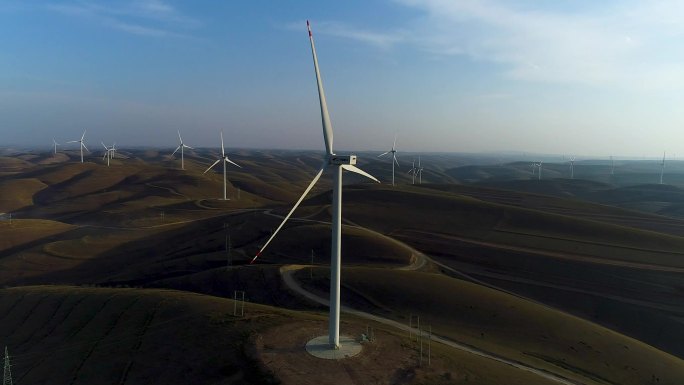 黄土高原山坡上绿色能源风车转动发电航拍