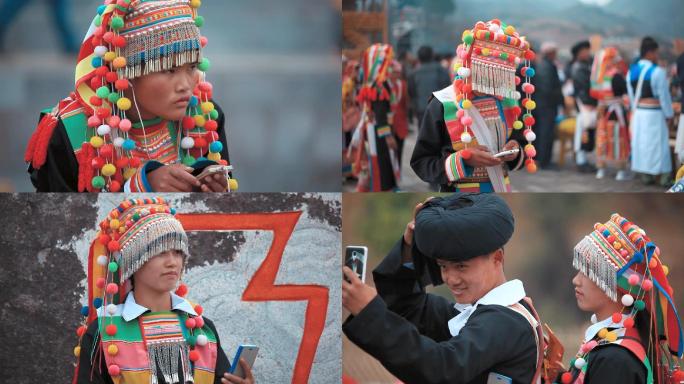 少数民族视频云南傈僳族阔时节玩手机年轻人