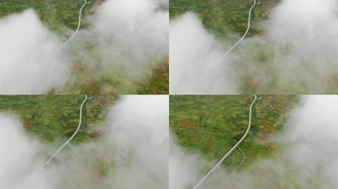 冲出大雾云层航拍俯冲公路高速路