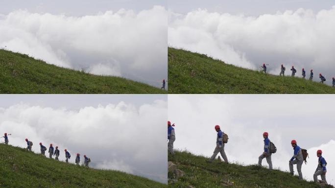 地质勘探队走过高山草地列队前行013