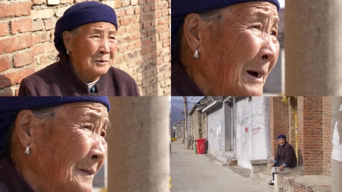 农村老人坐在路口慈祥的老奶奶