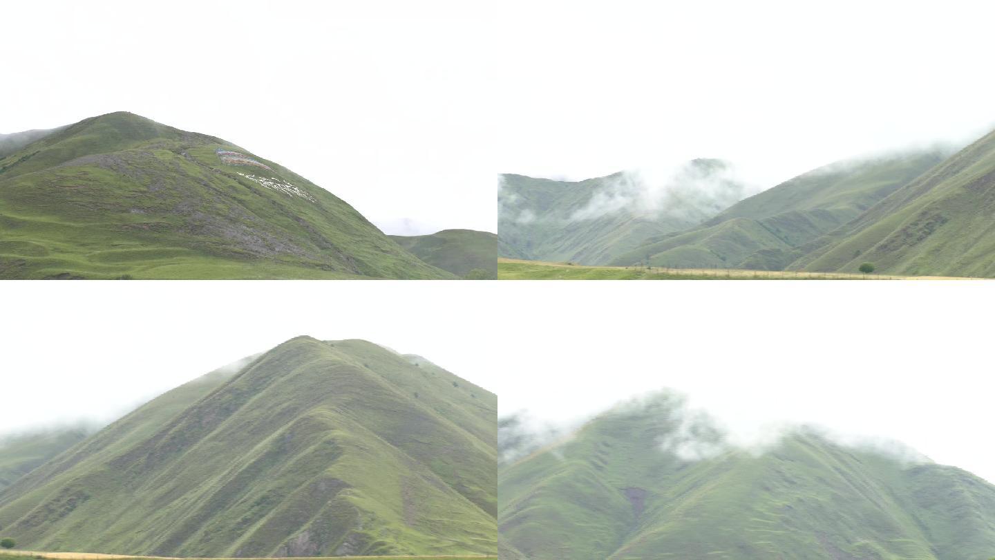 西藏山群山雨后的山脉大雾