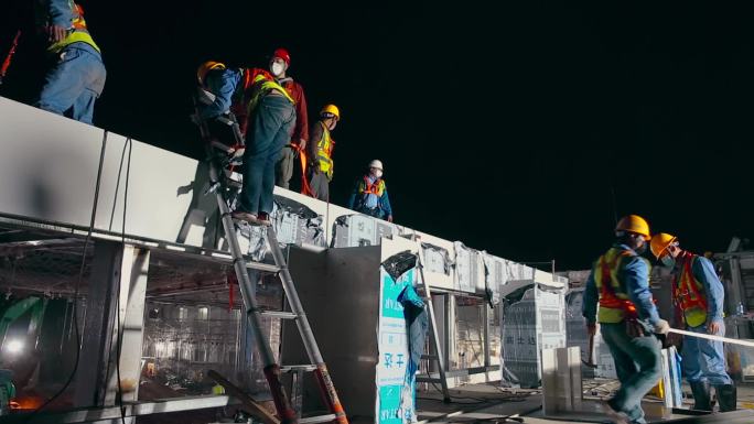 建设视频新型冠状病毒隔离医院夜晚屋顶施工