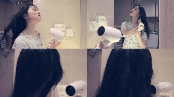美女吹头发电吹风吹干头发