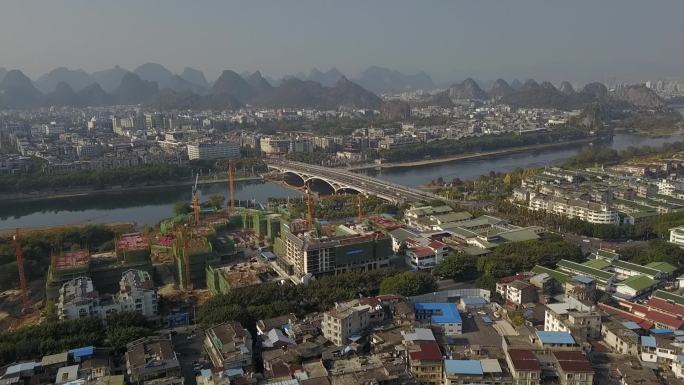 航拍桂林风景区工地漓江边的大剧院建设中