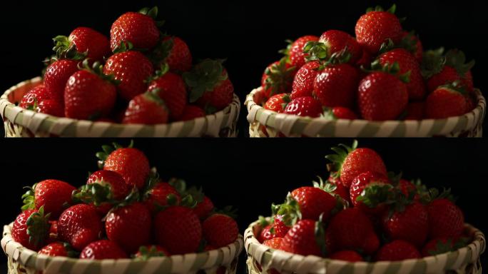 黑背景下篮子里的草莓