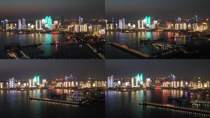 4K黄昏航拍青岛城市天际线灯光秀夜景