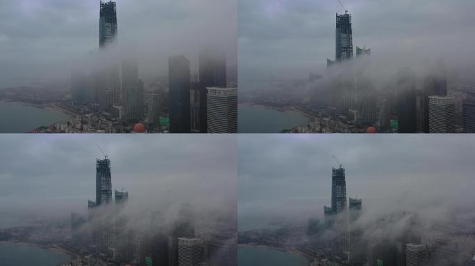 4K航拍青岛浮山湾海天中心平流雾穿越云