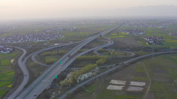 4K航拍陕西汉中城固高速公路立交桥油菜花