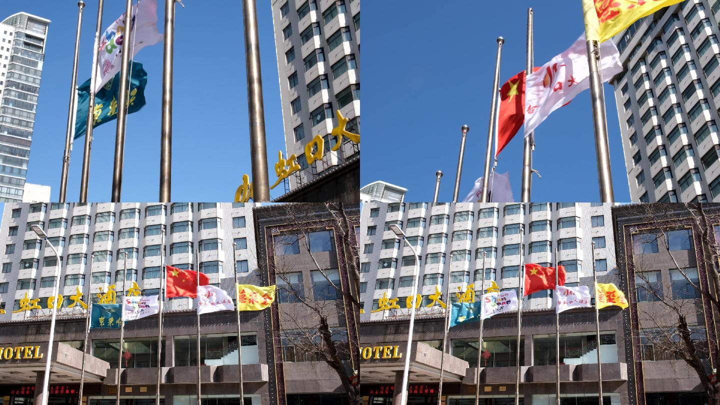 酒店宾馆降半旗致哀狂风中的半旗