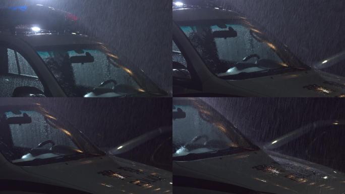 黑夜里雨水拍打警车升格拍摄