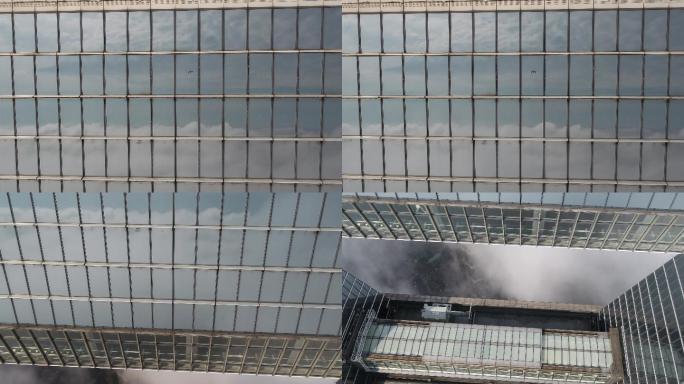 4K原素材-摩天大楼玻璃幕墙上大疆无人机