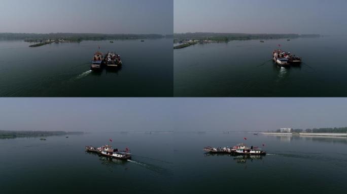 航拍汉江国家湿地公园长寿岛汽渡码头拖船