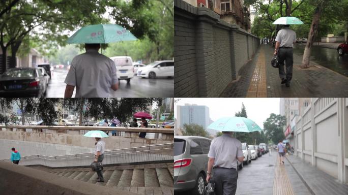雨天打伞走路的男人