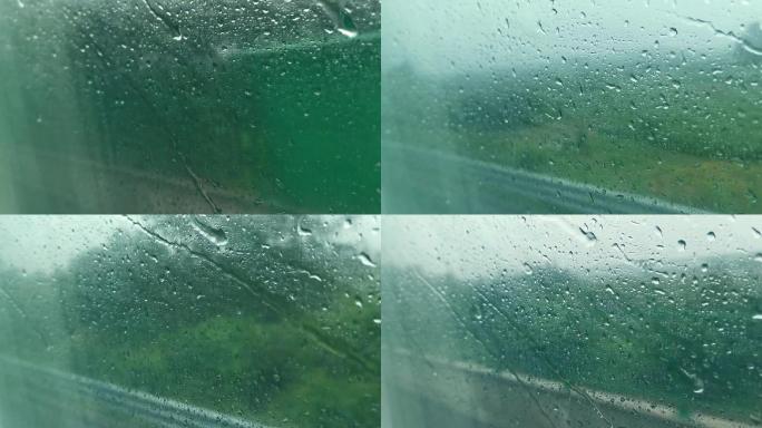 水珠雨水打在车的玻璃上