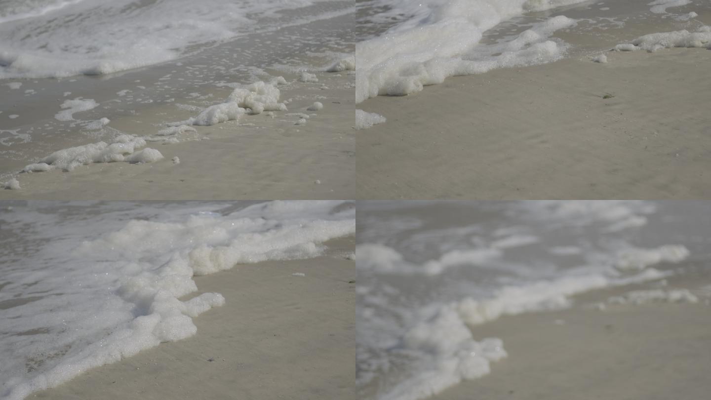 沙滩海边海水污染泡沫