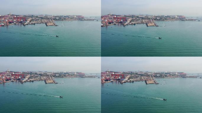 青岛海边的港口码头及行驶的小船航拍