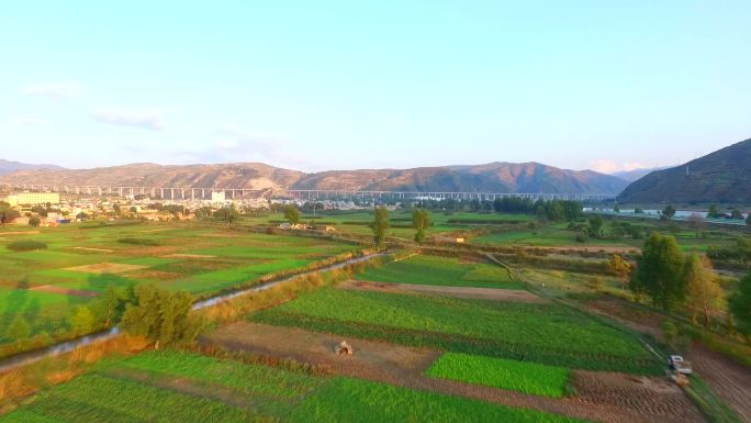 航拍岷县黄芪种植基地落日河流村庄