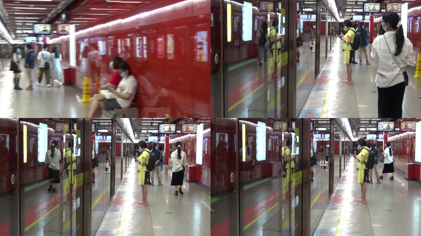 夏天广州地铁周末休闲的市民等待地铁进站