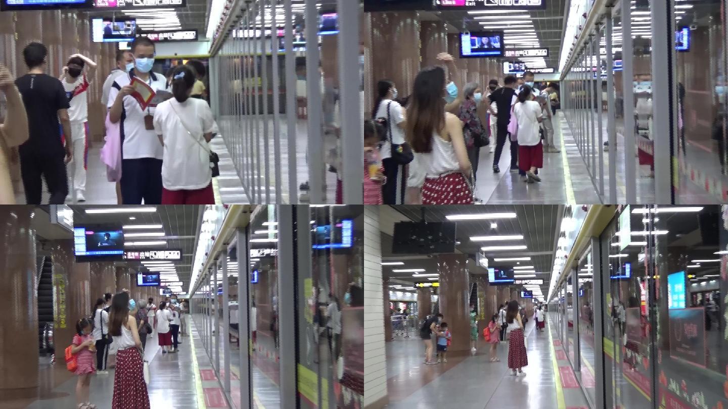 广州现代化地铁内，市民在站台等待地铁进站