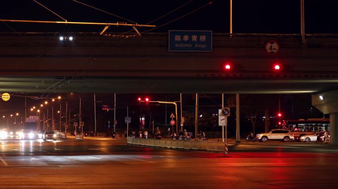 迎面车辆灯光，夜晚城市街景，车流