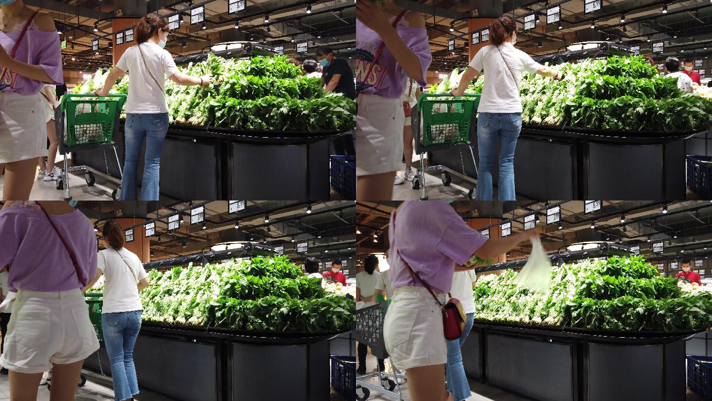 消费者在超市生鲜柜选购蔬菜