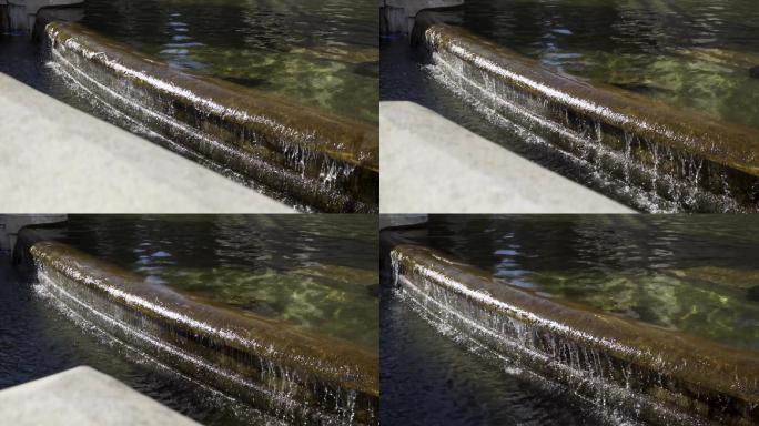 池水喷泉水流溢出广场公园