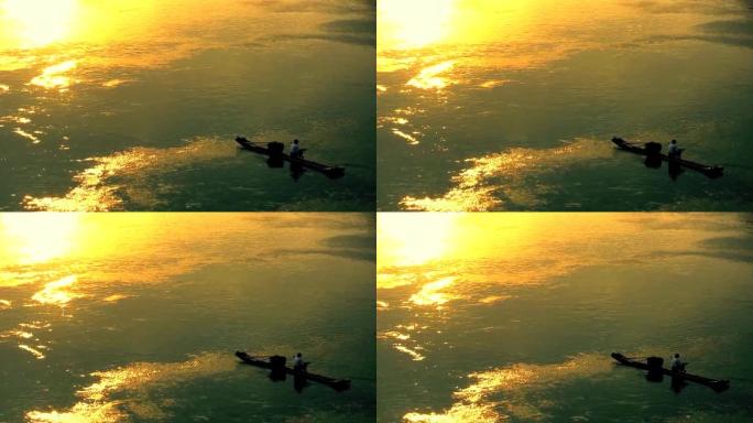 夕阳下人在江边钓鱼