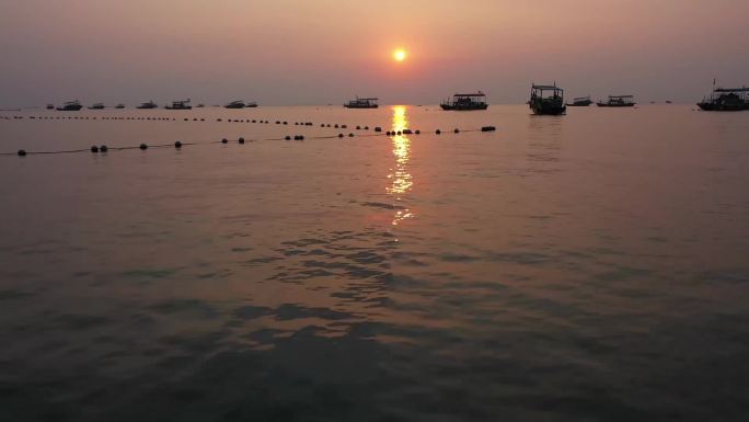 巽寮湾夕阳海滩渔船海上-广东惠州巽寮湾风