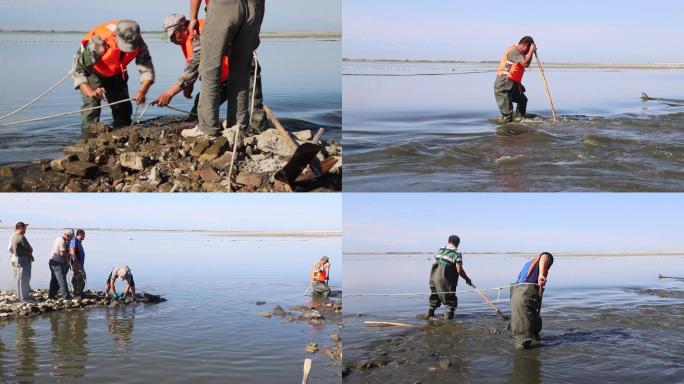 水利工人湖水中清除杂物，石块，淤泥