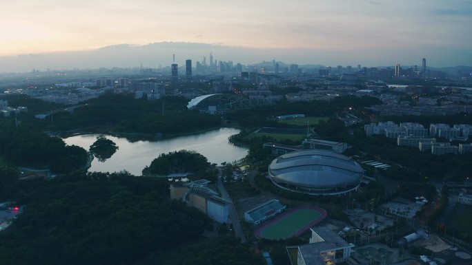 航拍晚霞中的广州大学城羽毛球馆