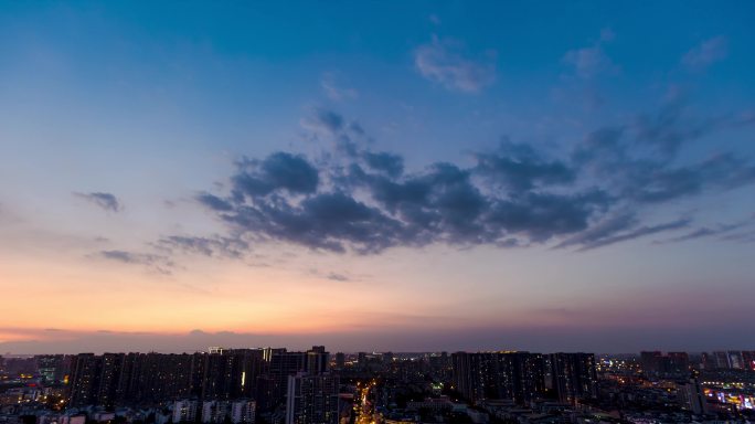 城市天空延时城市日落晚霞彩霞日转夜延时