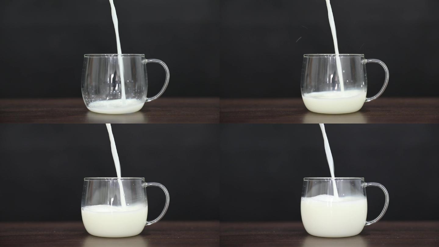 黑色背景下牛奶缓慢倒入玻璃杯的升格视素