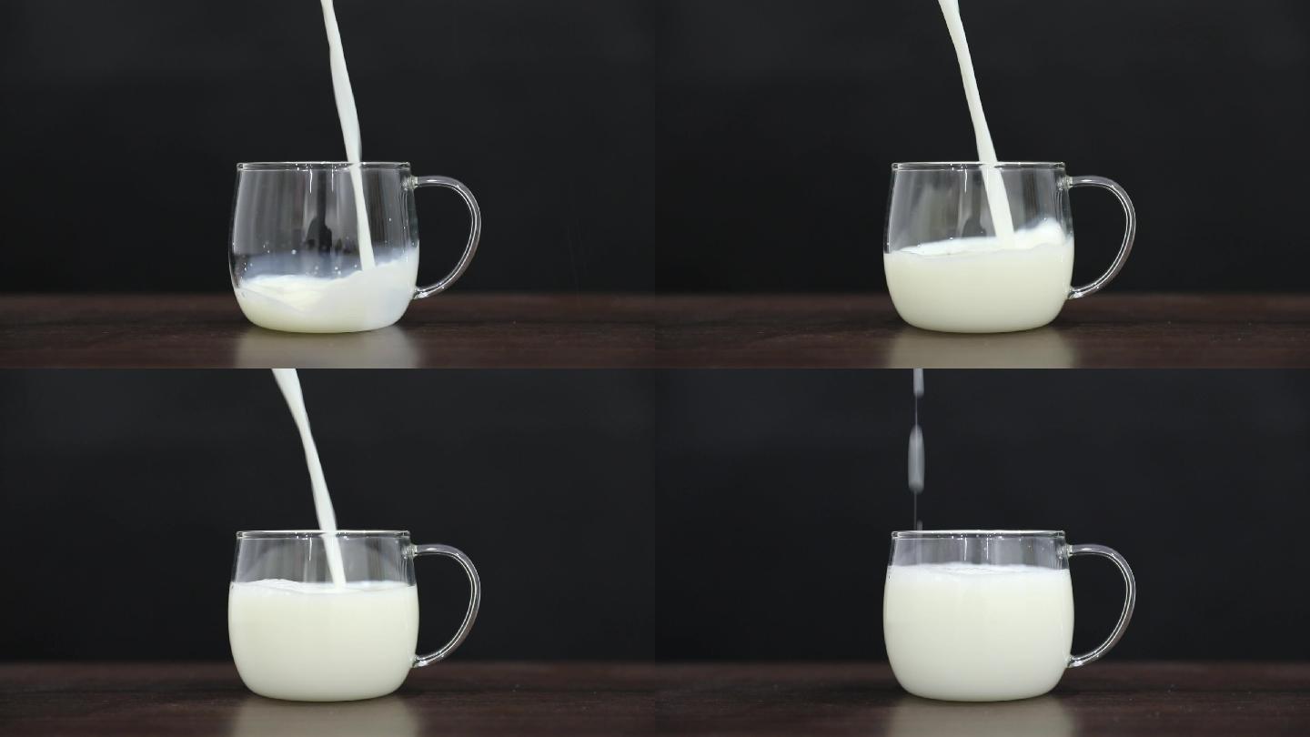 黑色背景下牛奶缓慢倒入玻璃杯的素材