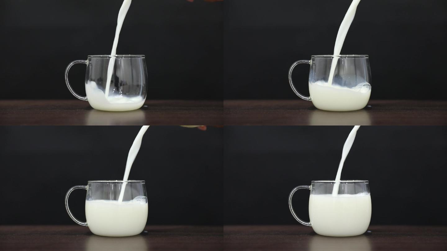黑色背景下牛奶缓慢倒入玻璃杯升格素材