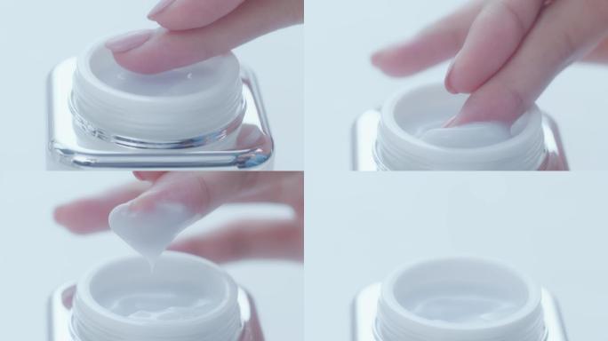 化妆品体验纤细手指涂抹精华营养霜乳