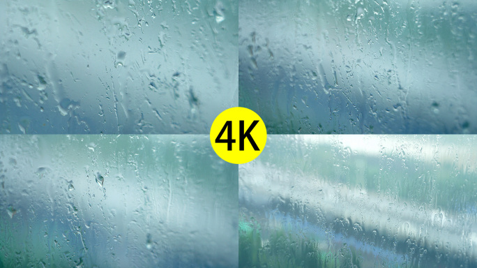 窗户上的雨水水滴下落4K